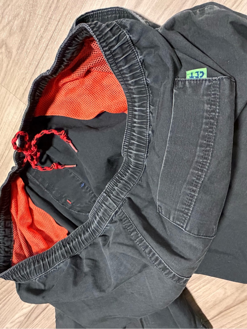 Vintage 90s Tropicalia Swim Board Shorts
Black shorts with orange mesh lining